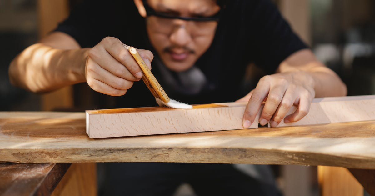 Which Schengen visa should one apply for when visiting a workshop? - Concentrated young ethnic master varnishing wooden detail in workshop Which Schengen visa should one apply for when visiting a workshop? - Concentrated young ethnic master varnishing wooden detail in workshop
