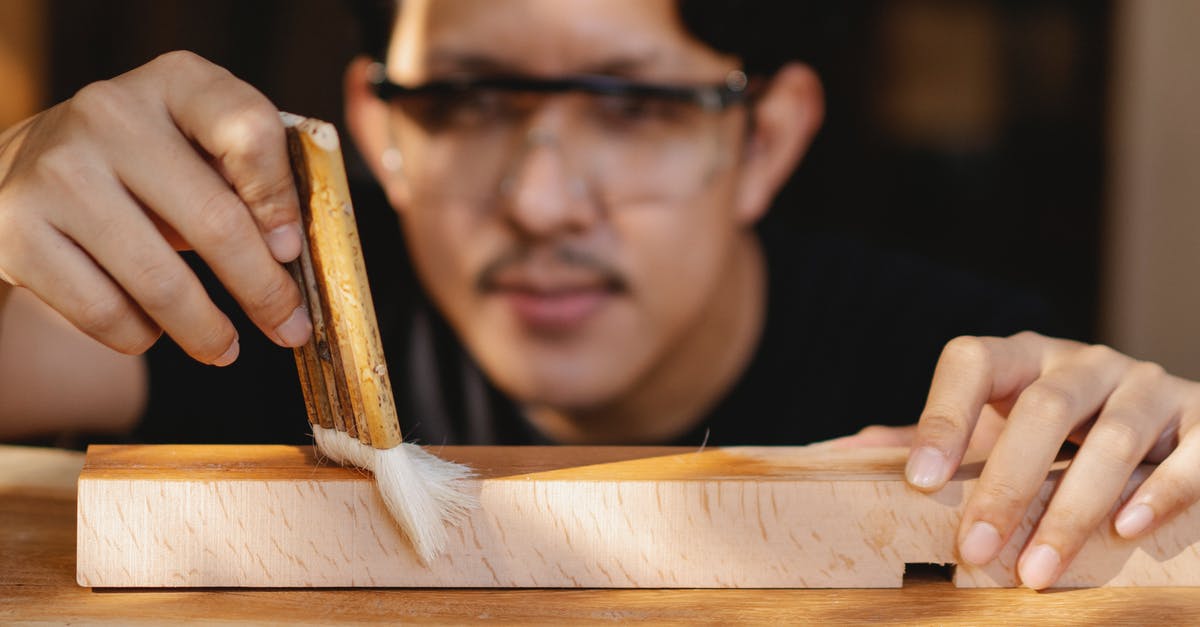 Which Schengen visa should one apply for when visiting a workshop? - Professional artisan varnishing wooden detail in workplace Which Schengen visa should one apply for when visiting a workshop? - Professional artisan varnishing wooden detail in workplace
