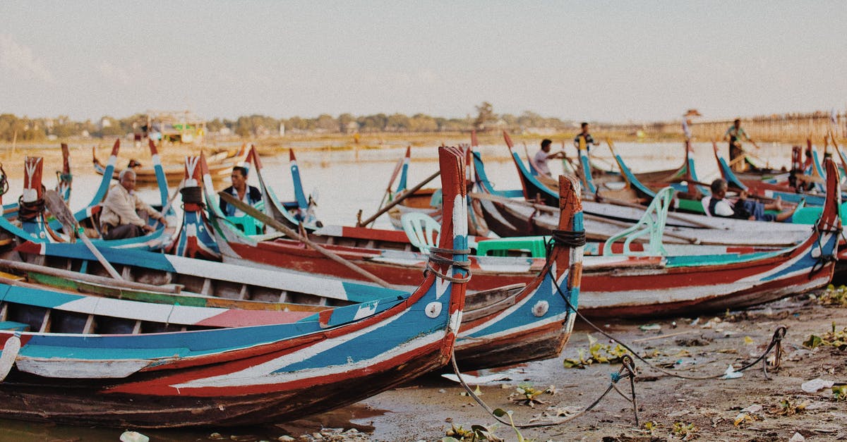 Which Thai provinces don't allow inter-provincial travel? - Colorful wooden fishing boats on sandy seashore Which Thai provinces don't allow inter-provincial travel? - Colorful wooden fishing boats on sandy seashore