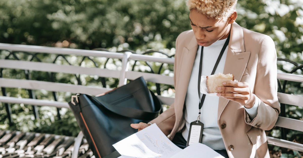 Which visa is applicable to me? Visitor or Short Student Study Visa - Serious woman looking through documents