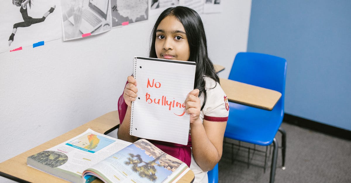 Which websites allow "search by country" for a flight? - Girl Showing a Message Written in a Notebook Which websites allow "search by country" for a flight? - Girl Showing a Message Written in a Notebook