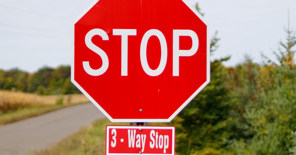 Who has right-of-way at this stop sign; left-turner who arrived first, or non-turner who arrived later? [closed] - Close up of Stop Sign