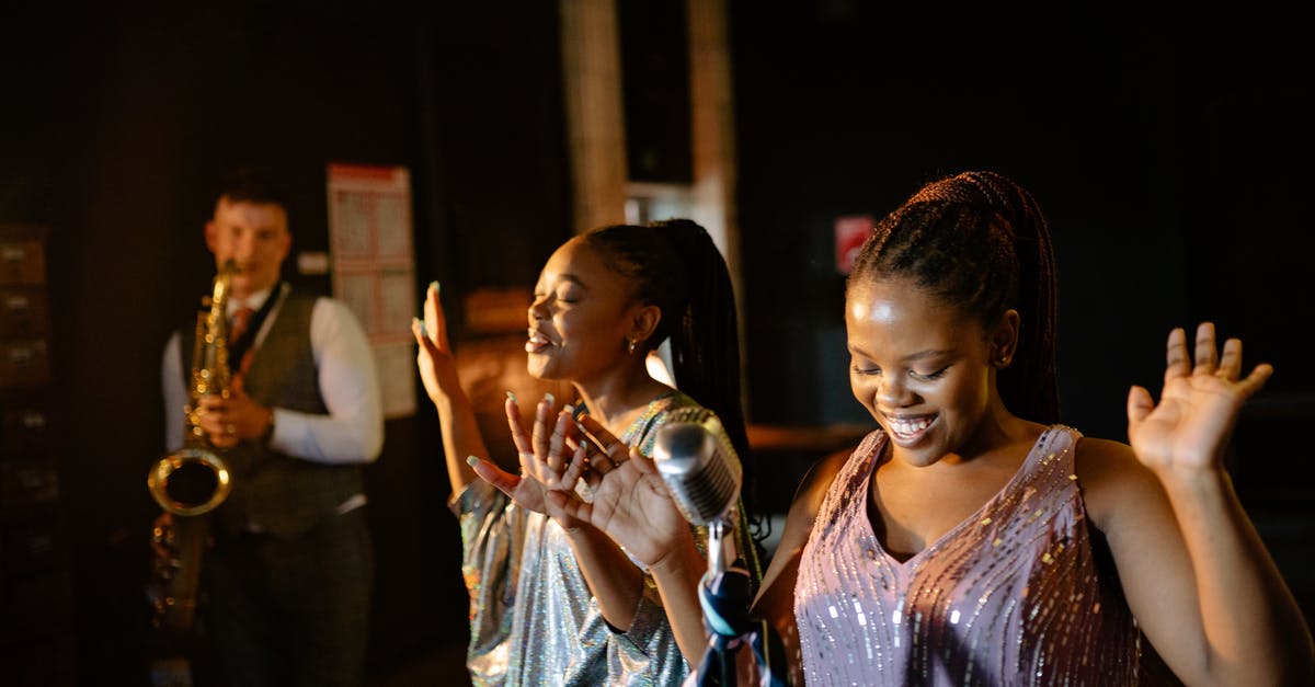 Who is performing the music played on the loudspeakers at Santuario del Cerro San Cristobal, Santiago, Chile? - Women Singing Together