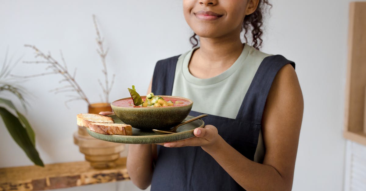 Whose responsibility is update to meal preference? - Woman in Blue Tank Top Holding Sliced Watermelon Whose responsibility is update to meal preference? - Woman in Blue Tank Top Holding Sliced Watermelon