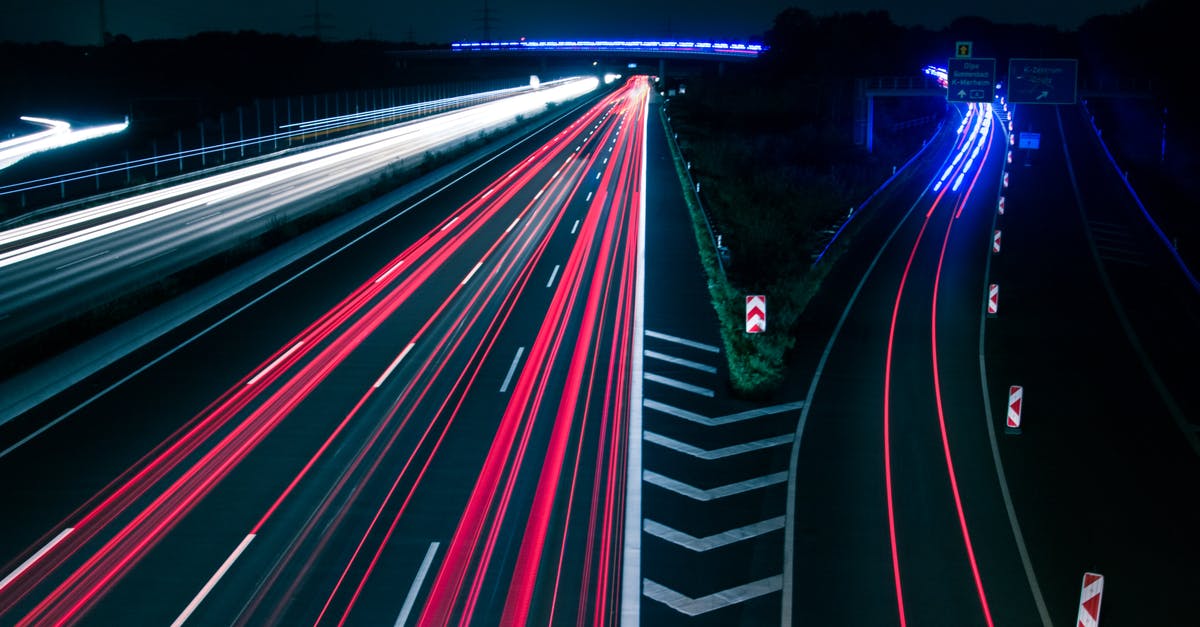 Why are California freeway exits painted with disconnected shoulder lines? - Light Trails on Road at Night Why are California freeway exits painted with disconnected shoulder lines? - Light Trails on Road at Night