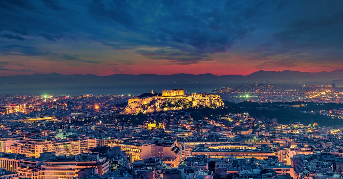 Why are flights departing Athens shorter than their returns at night? [closed] - City With High Rise Buildings Under Orange and Blue Sky