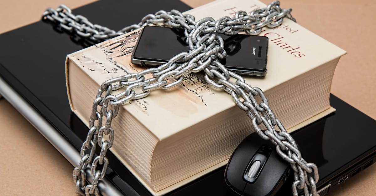 Why are mobile phones prohibited at many consulates? - Black Android Smartphone on Top of White Book Why are mobile phones prohibited at many consulates? - Black Android Smartphone on Top of White Book
