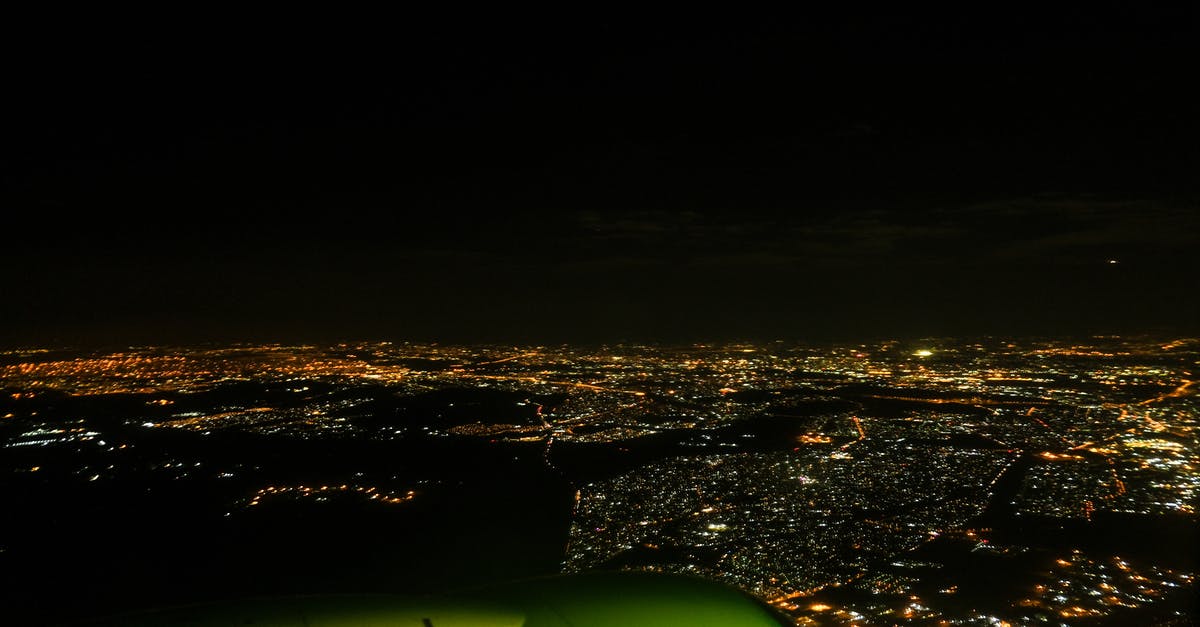 Why are plane lights dimmed before landing at night? [duplicate] - View at the Airplane at Night 