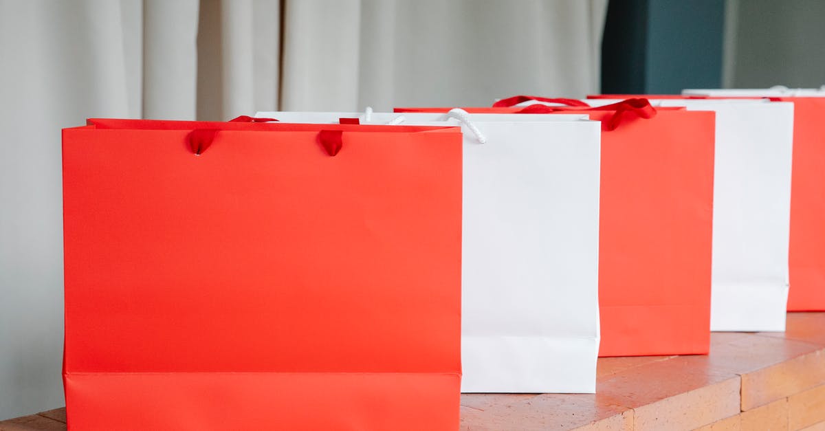 Why are so many airline check-in counters idle so often? - Set of red and white paper shopping bags placed on brick shelf in studio Why are so many airline check-in counters idle so often? - Set of red and white paper shopping bags placed on brick shelf in studio