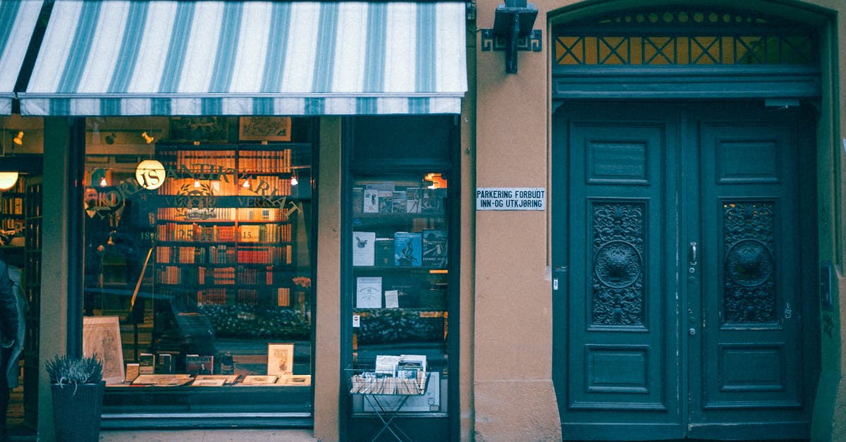 Why are some hotels asking you to book through Booking.com instead of matching the price at the front desk? - Bookstore building facade on pavement in city