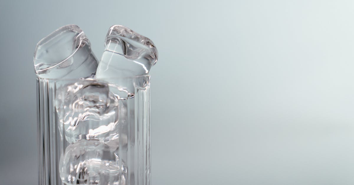 Why are there holes in ice cubes in airplanes? - Clear Glass Bottle With Water Why are there holes in ice cubes in airplanes? - Clear Glass Bottle With Water
