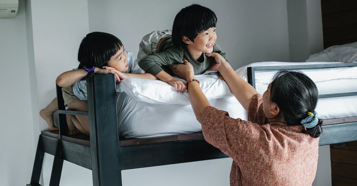 Why are there no 2,3,4,5 tier bunk beds on airplanes? - Asian kids on bunk bed near grandmother Why are there no 2,3,4,5 tier bunk beds on airplanes? - Asian kids on bunk bed near grandmother