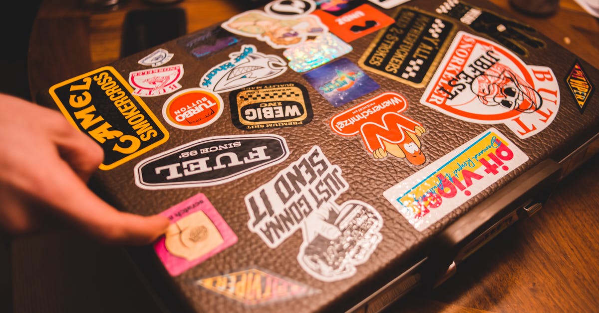Why aren't there cube-shaped suitcases or bags? - Black suitcase with stickers placed on table Why aren't there cube-shaped suitcases or bags? - Black suitcase with stickers placed on table