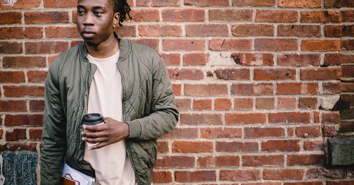 Why can't I book this multi-city fare on American Airlines? - Pensive young man with coffee and notebooks standing near wall Why can't I book this multi-city fare on American Airlines? - Pensive young man with coffee and notebooks standing near wall