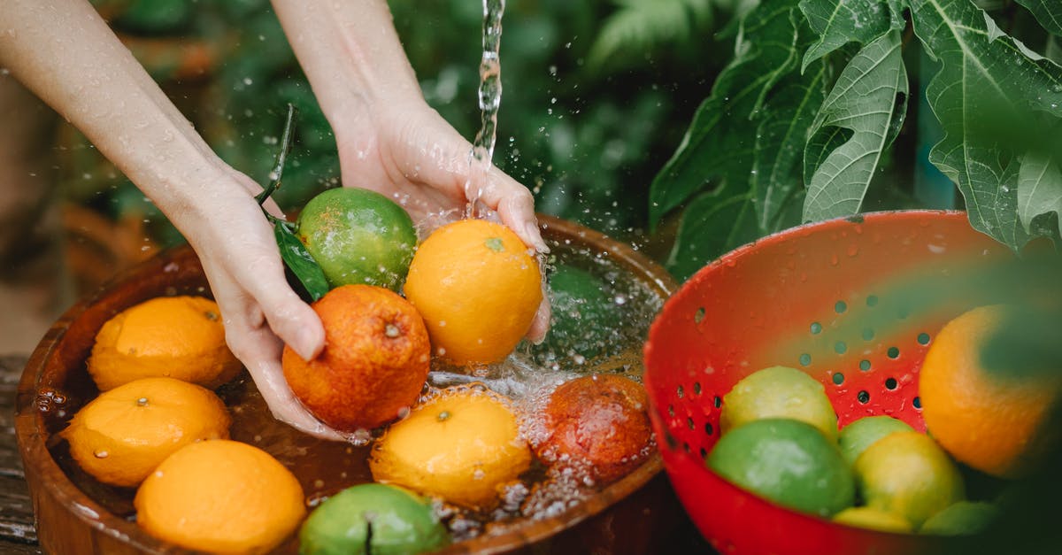 Why did airport security swab my hands with wet paper? - Woman washing fresh fruits in tropical orchard Why did airport security swab my hands with wet paper? - Woman washing fresh fruits in tropical orchard