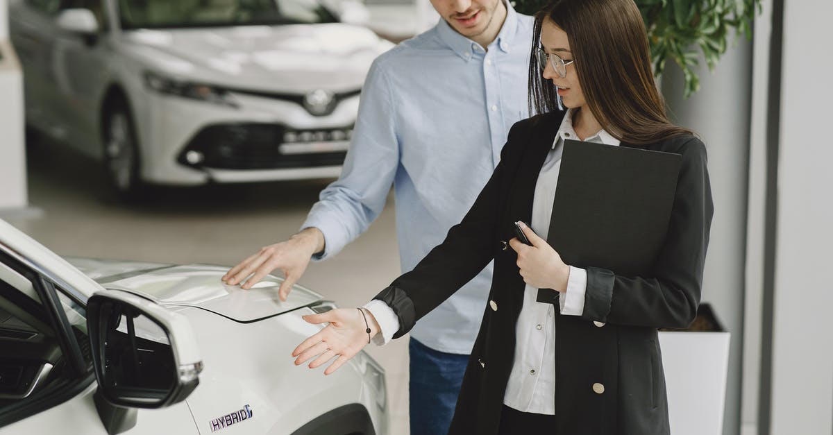 Why didn't the check-in agent recognize my long term visa? - Man and Woman Looking at a Vehicle Why didn't the check-in agent recognize my long term visa? - Man and Woman Looking at a Vehicle