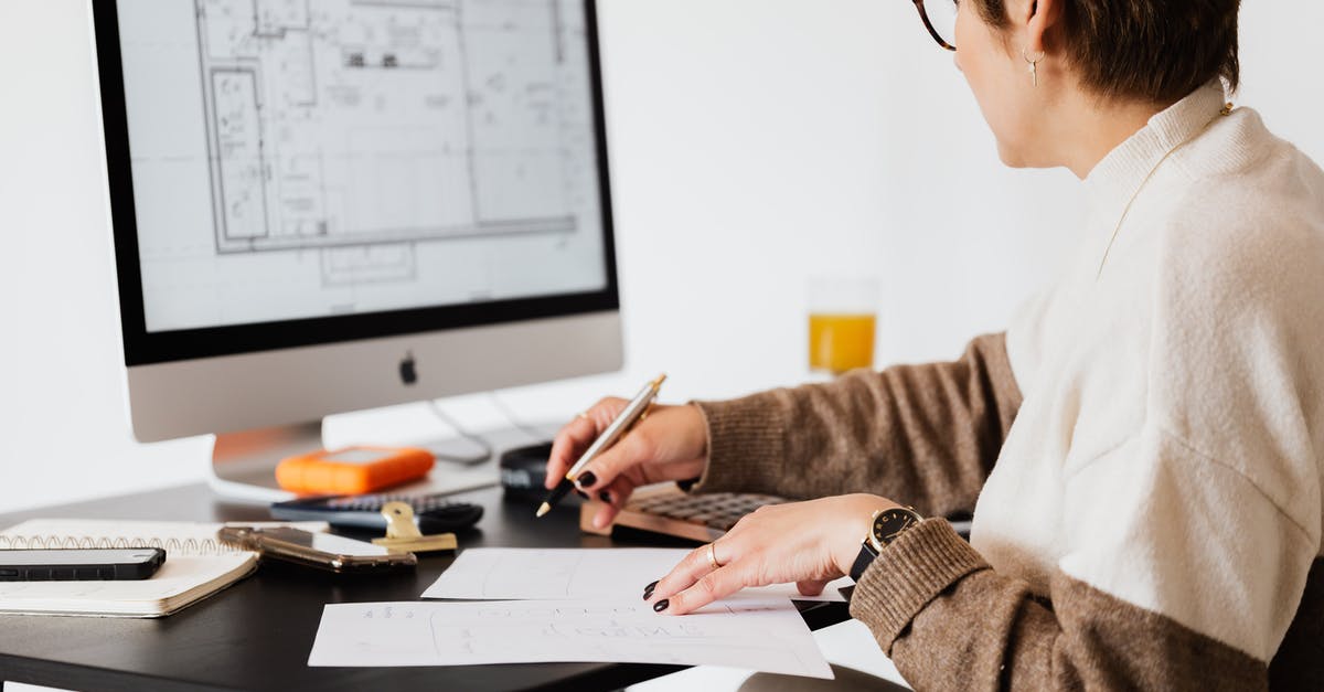 Why didn't the check-in agent recognize my long term visa? - Crop estate agent working with computer in office Why didn't the check-in agent recognize my long term visa? - Crop estate agent working with computer in office