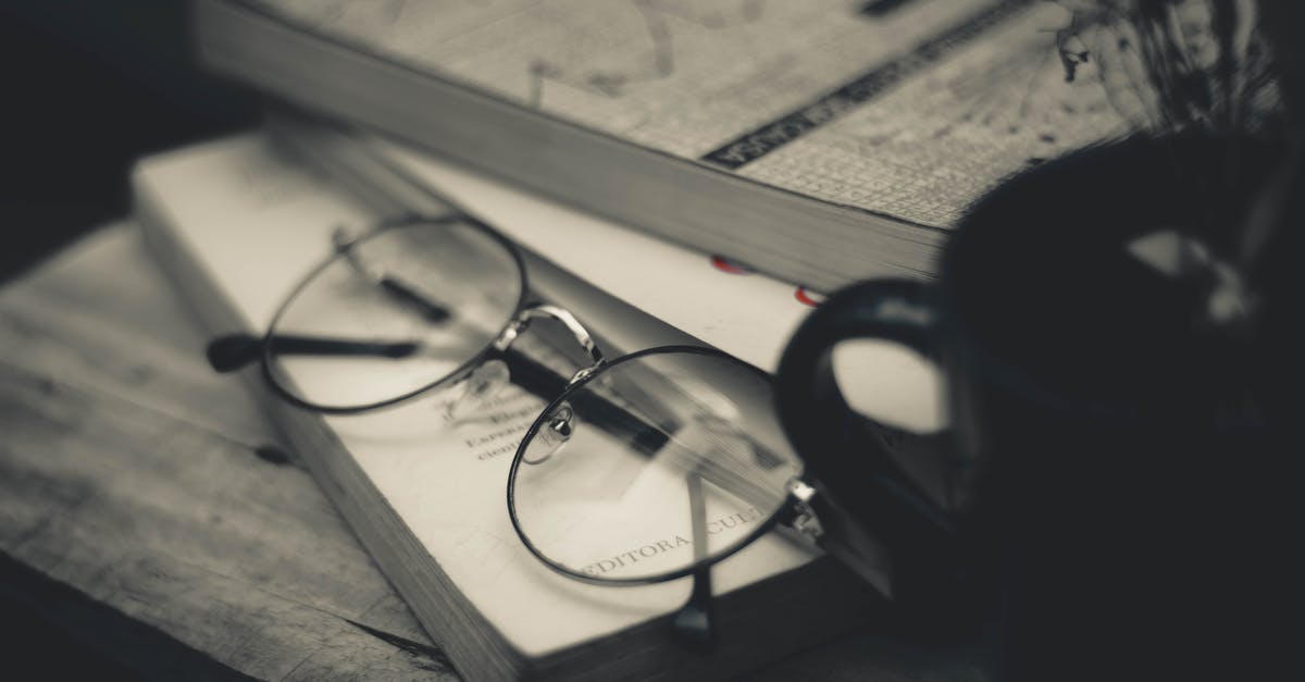 Why different fees for Vietnam Visa Approval Letters - Pile of textbooks near eyeglasses and mug with dried sprigs Why different fees for Vietnam Visa Approval Letters - Pile of textbooks near eyeglasses and mug with dried sprigs