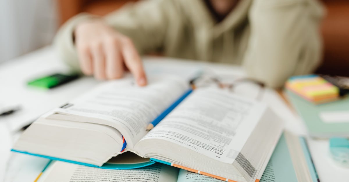 Why do (a lot of) people book airline ticket through agencies? [closed] - Person Touching a Book