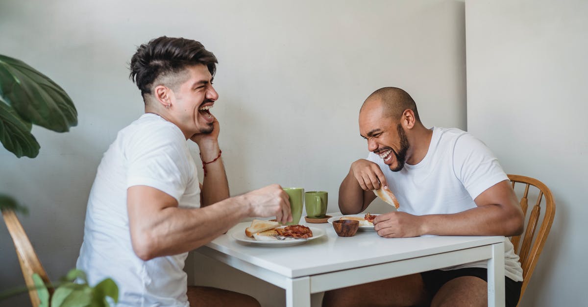 Why do airlines prohibit having two infants in the same row? - Two Friends Sitting at Table and Having Fun at Breakfast Why do airlines prohibit having two infants in the same row? - Two Friends Sitting at Table and Having Fun at Breakfast