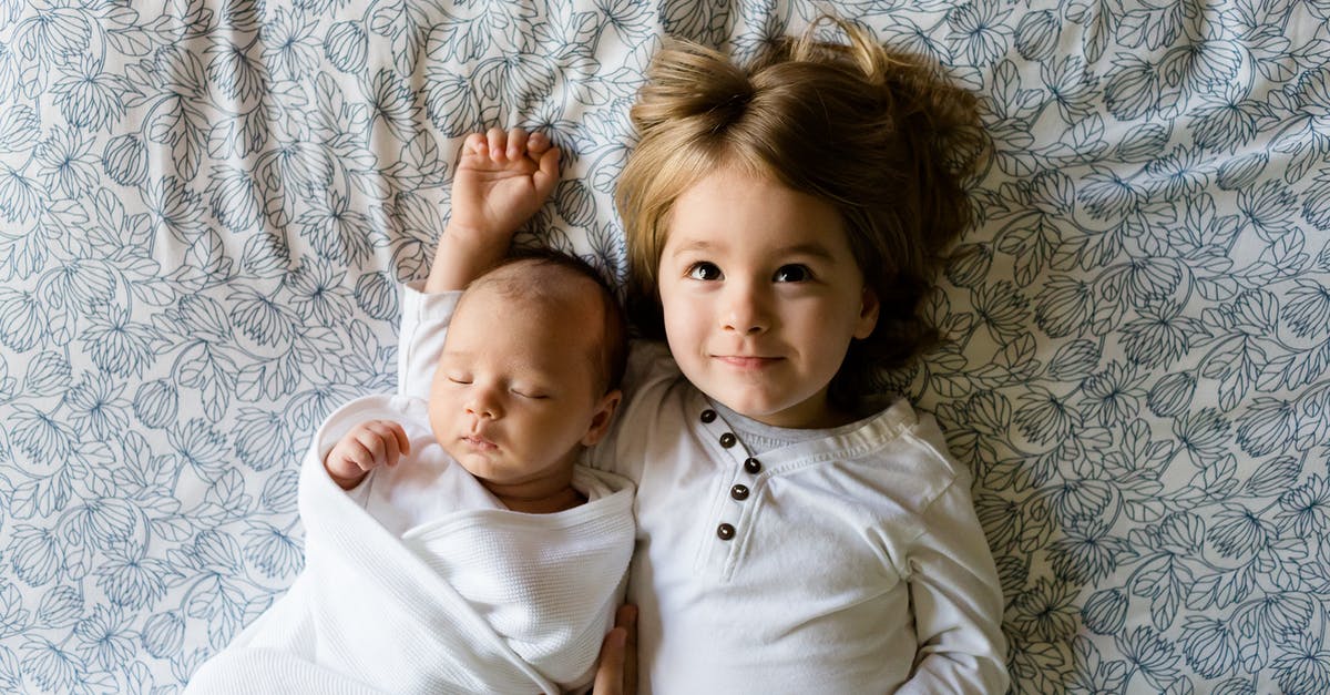 Why do airlines prohibit having two infants in the same row? - Baby Sleeping Beside Girl on Gray Floral Textile Why do airlines prohibit having two infants in the same row? - Baby Sleeping Beside Girl on Gray Floral Textile