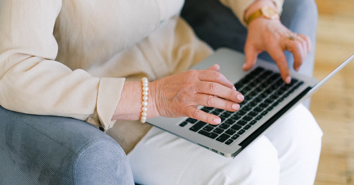 Why do I need to report to the Spanish embassy after return to my home country? - Senior woman typing important report on keyboard of laptop Why do I need to report to the Spanish embassy after return to my home country? - Senior woman typing important report on keyboard of laptop