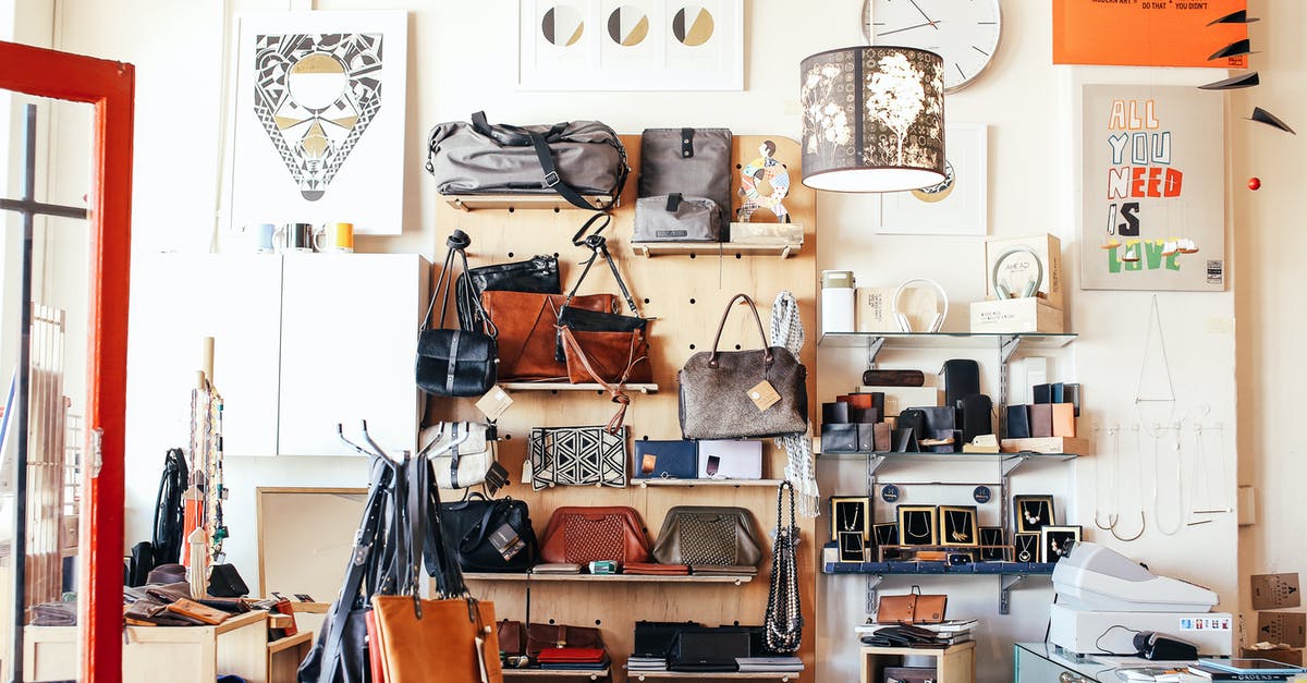 Why do many airports offer bag wrapping services? - Assorted purses on shelves in shop Why do many airports offer bag wrapping services? - Assorted purses on shelves in shop