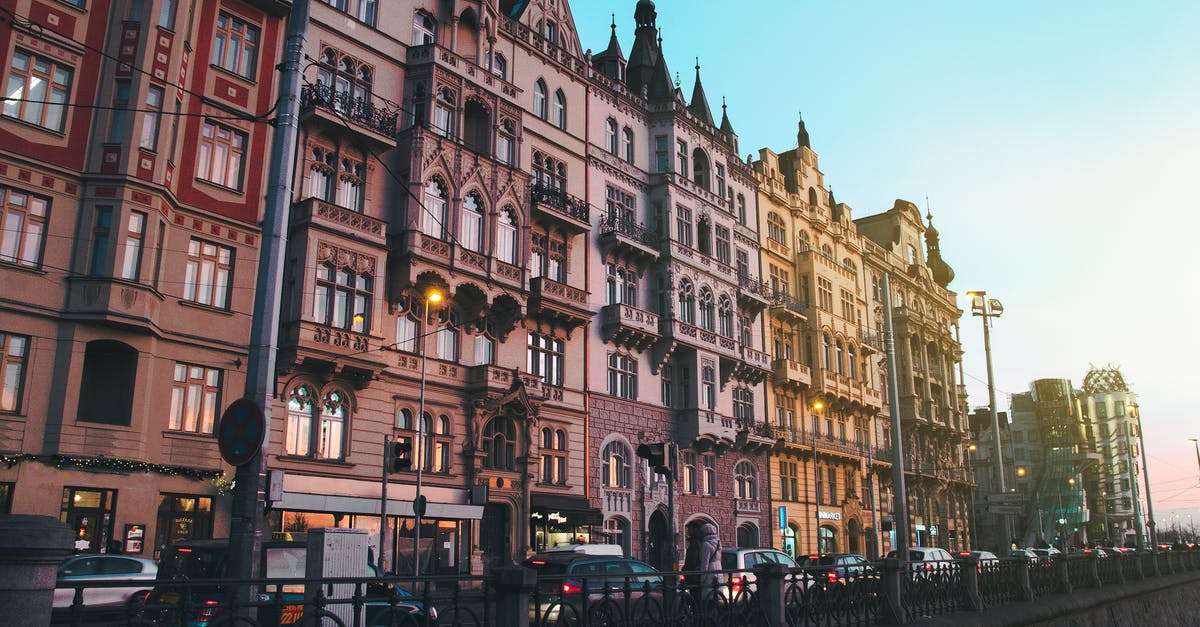 Why do Prague streets use double street addresses? - Vehicles Parked Near High-rise Building Why do Prague streets use double street addresses? - Vehicles Parked Near High-rise Building