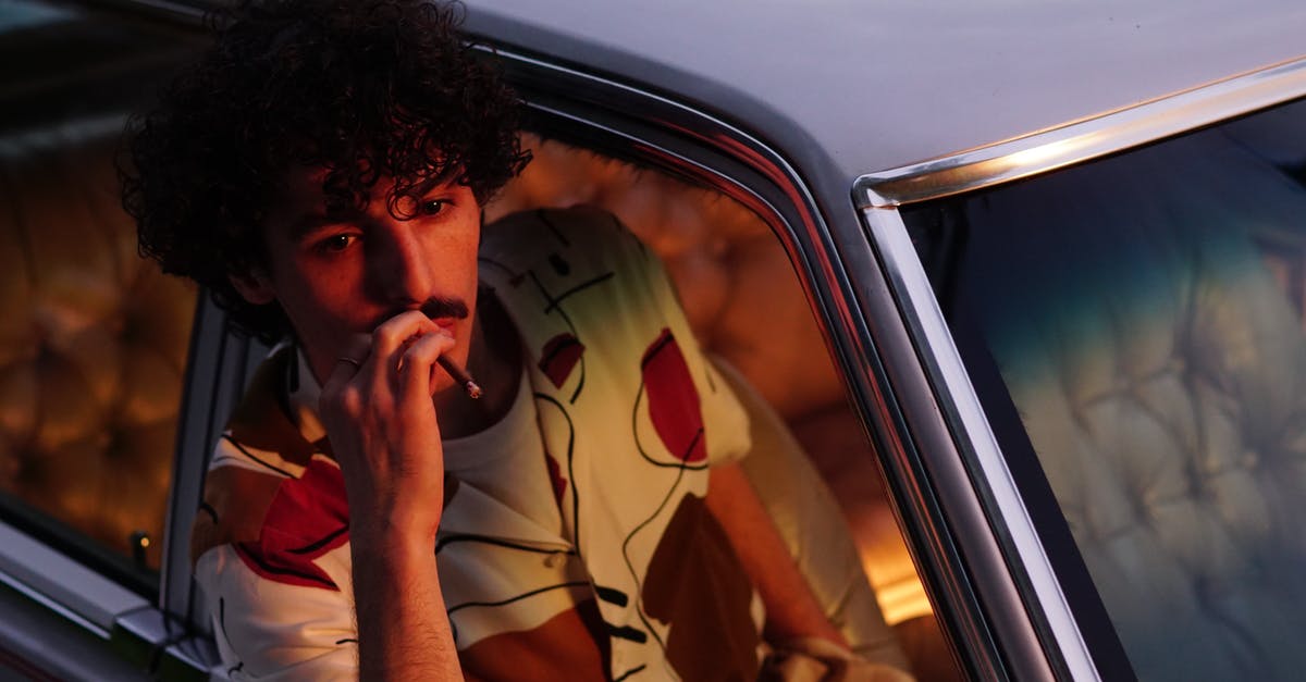 Why do rental car companies hand you two keys wired together? - Man Smoking a Cigarette in Car Window Why do rental car companies hand you two keys wired together? - Man Smoking a Cigarette in Car Window