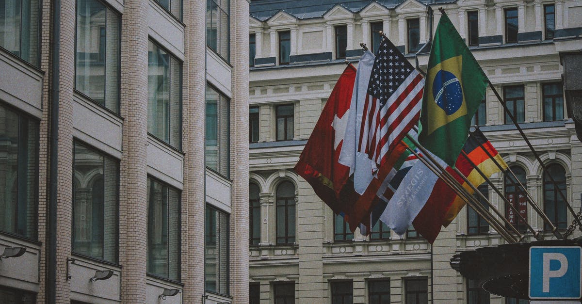 Why do some hostels only allow international visitors? - Flags on Poles in Front of Building Why do some hostels only allow international visitors? - Flags on Poles in Front of Building