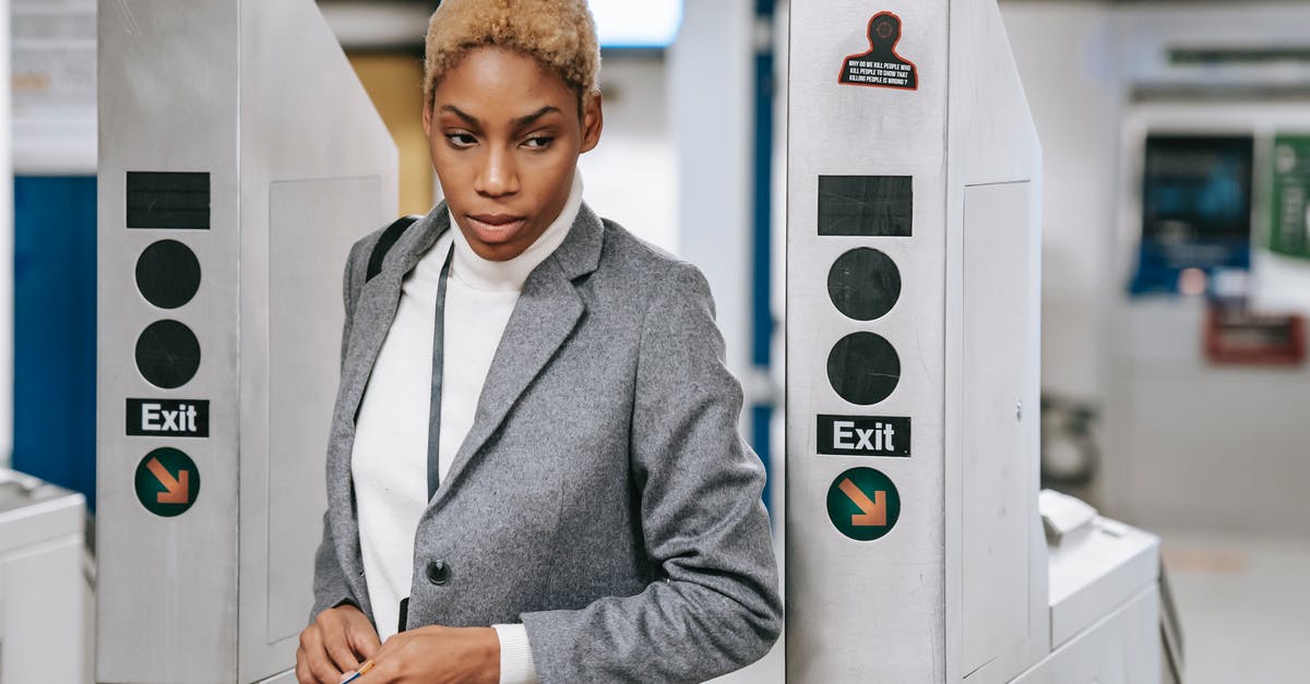 Why do some Smart Gate passports need to be stamped? - Stylish young ethnic woman going through metro entrance gate Why do some Smart Gate passports need to be stamped? - Stylish young ethnic woman going through metro entrance gate
