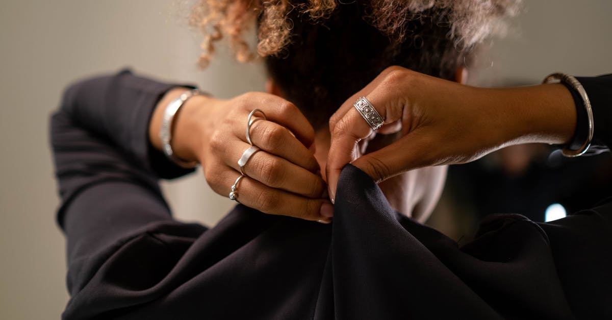 Why do we fasten seatbelts for turbulence? - A Woman Zipping Her Black Dress Why do we fasten seatbelts for turbulence? - A Woman Zipping Her Black Dress