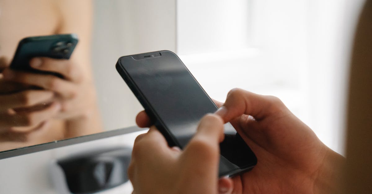 Why does Airbnb show restricted search results when logged-in? [closed] - Crop unrecognizable person standing and using modern smartphone in light room in daytime