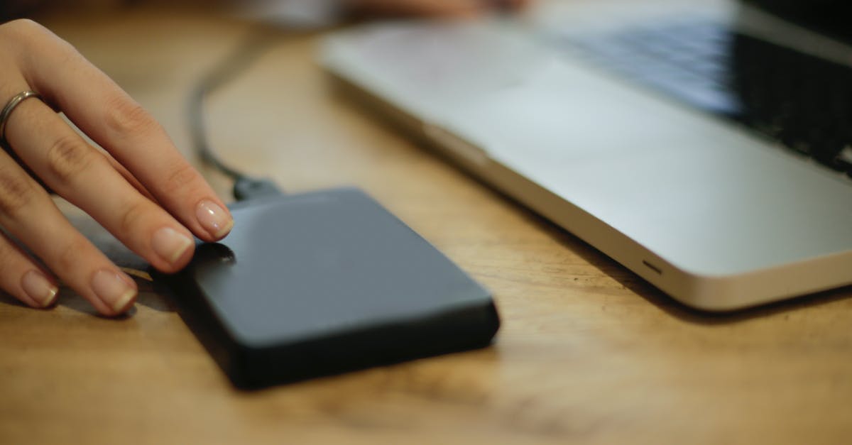 Why does my laptop charger not work with this adapter? - Black Square Device on Brown Wooden Table Why does my laptop charger not work with this adapter? - Black Square Device on Brown Wooden Table