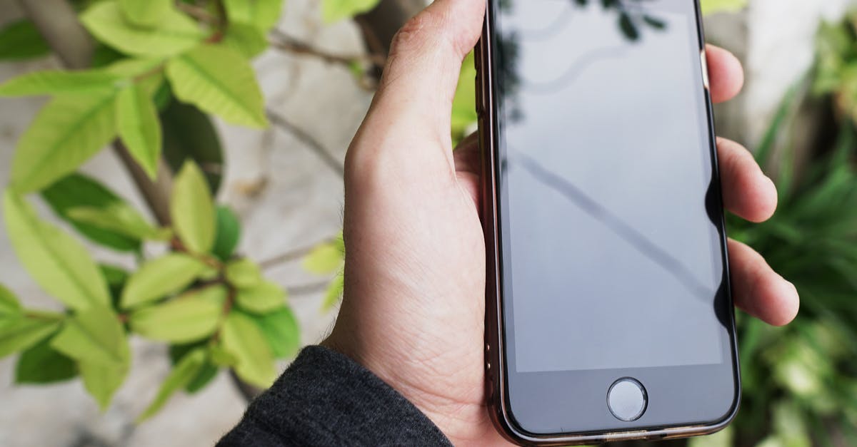 Why does my phone enable camera shutter sounds whenever I insert an Indian SIM? - Person Holding Black Iphone 4 Why does my phone enable camera shutter sounds whenever I insert an Indian SIM? - Person Holding Black Iphone 4