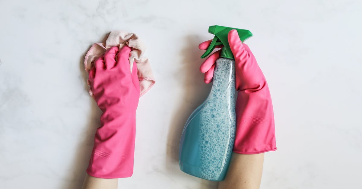 Why does the TSA have a 100ml container rule for liquids when I can put the same liquid in all of the containers? - A Person Cleaning Using Cleaning Products