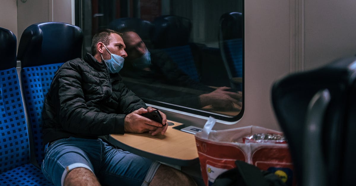 Why does this Polish night train have two different numbers? - Man in Black Leather Jacket Sitting on Black Leather Chair Why does this Polish night train have two different numbers? - Man in Black Leather Jacket Sitting on Black Leather Chair
