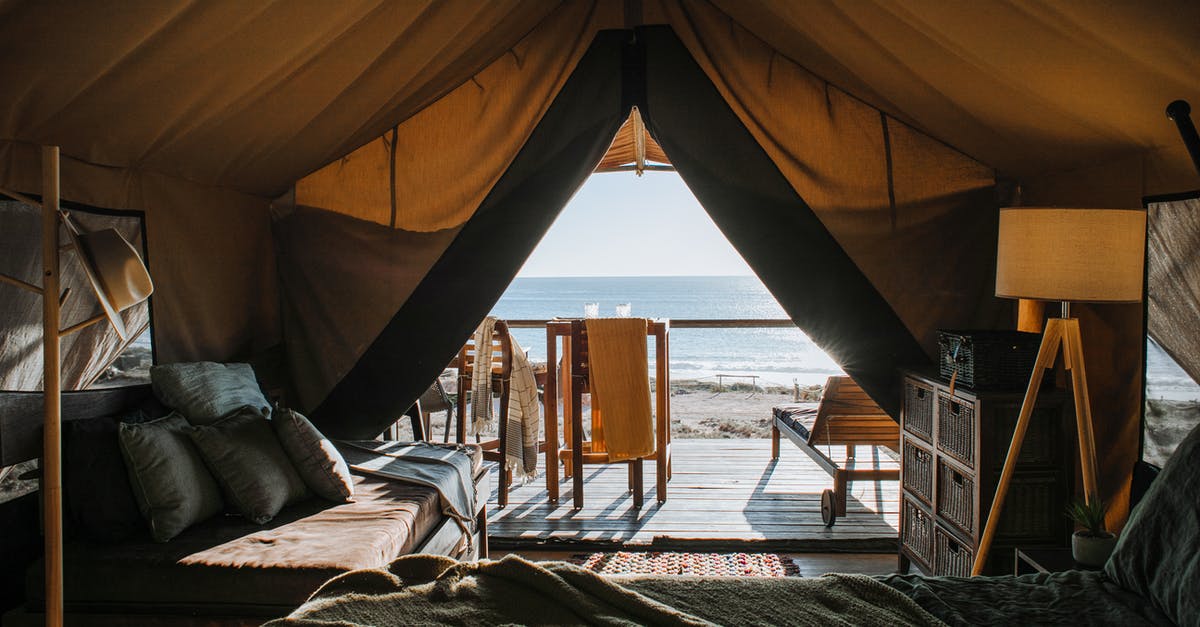 Why don't hotels in NZ have lamps? - Cozy tent with bed and terrace on beach Why don't hotels in NZ have lamps? - Cozy tent with bed and terrace on beach