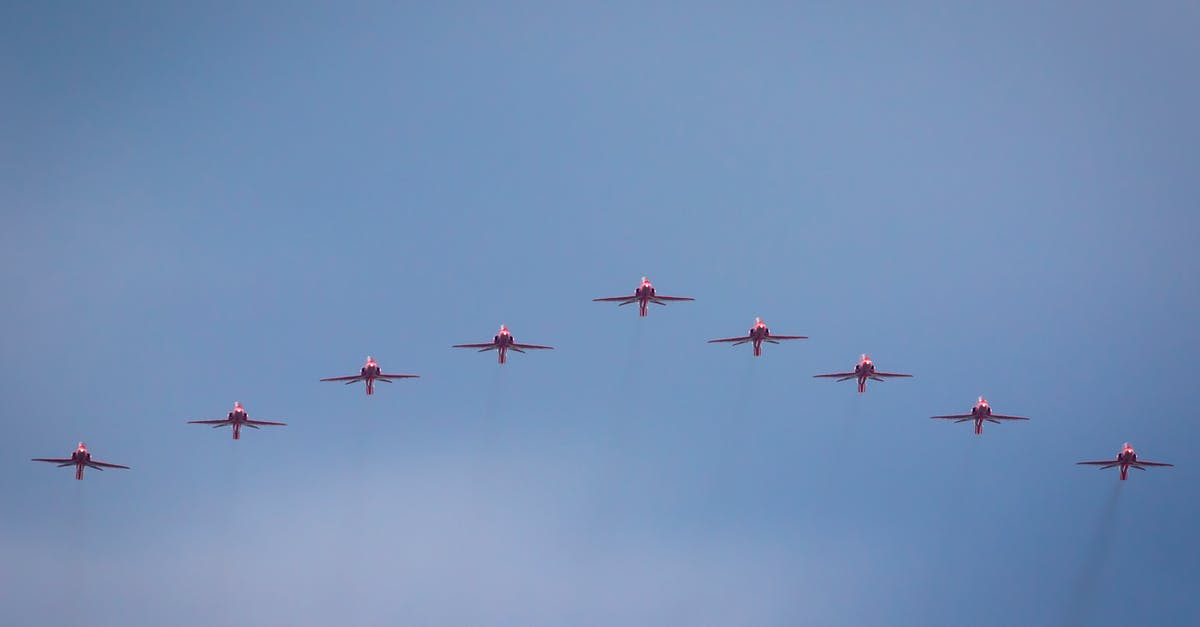 Why is flying to England so expensive this June/July? - Eight Red Jet Planes in Mid Air