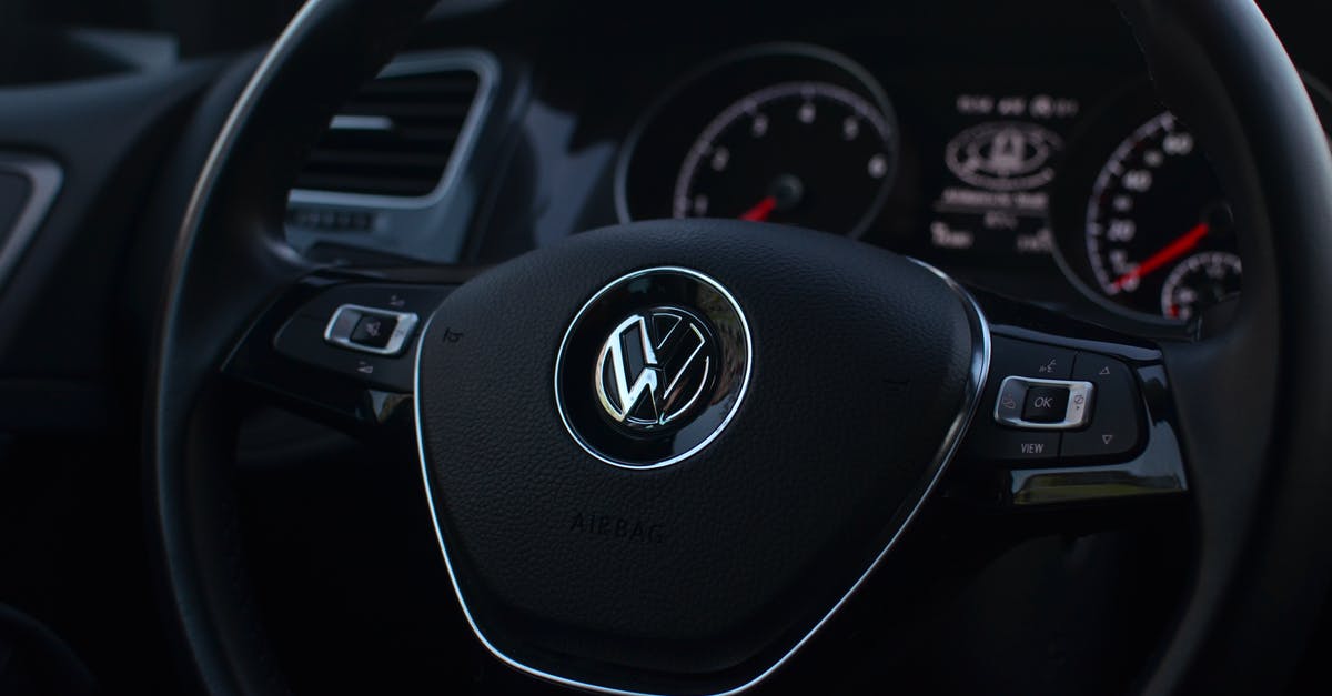 Why is it harder / more expensive to rent cars with automatic transmission in Europe? - Interior of modern automobile with buttons on steering wheel with panel containing instruments and controls Why is it harder / more expensive to rent cars with automatic transmission in Europe? - Interior of modern automobile with buttons on steering wheel with panel containing instruments and controls