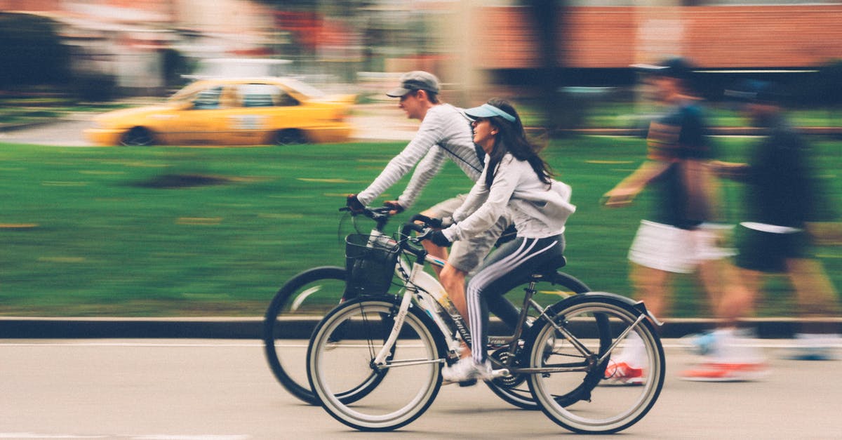 Why is taxi fare (in the UK at least) the same price for 1 as for 4 people - Woman and Man Riding on Bike