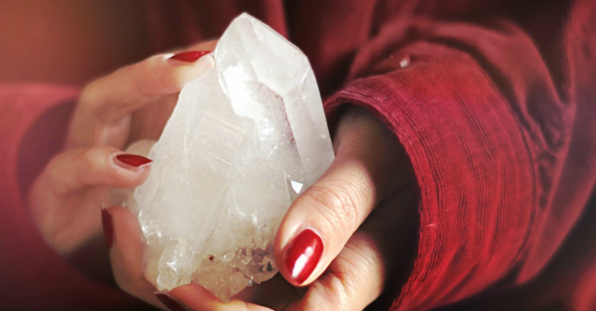 Why is the British passport the most valuable despite colonization? [closed] - Close-Up Photo of Person Holding Crystal Stone