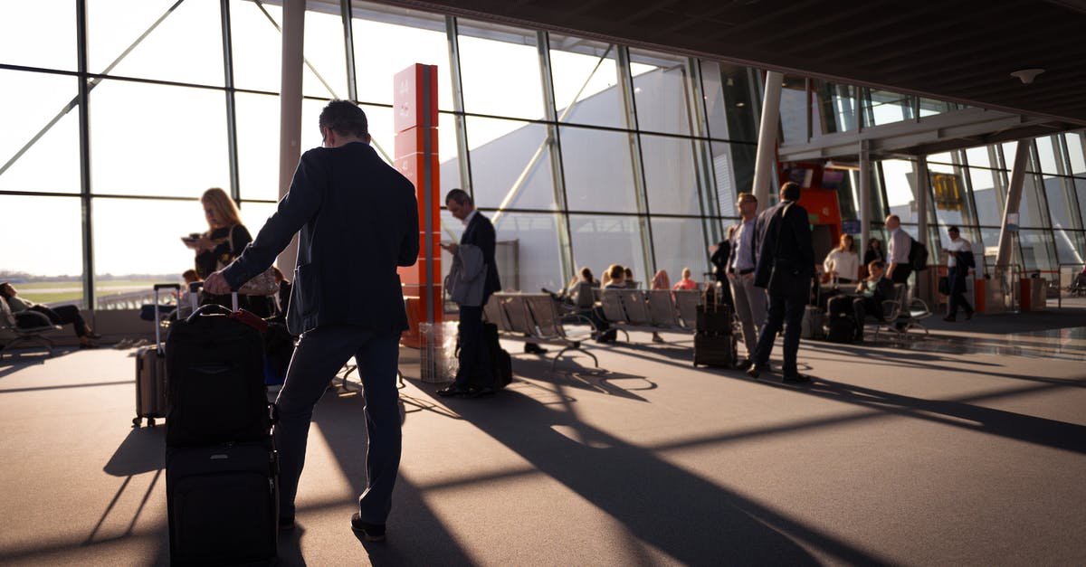 Why is the Dubai airport so busy? - Busy People on the Airport Terminal Why is the Dubai airport so busy? - Busy People on the Airport Terminal