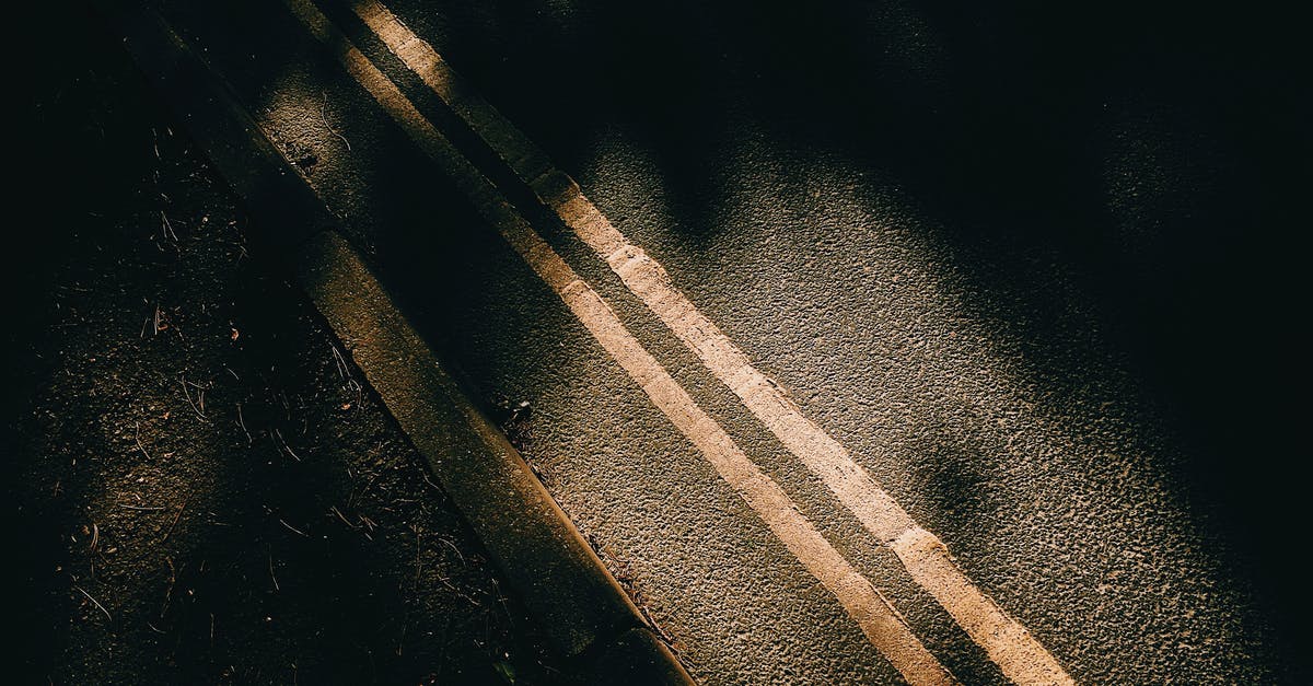 Why is the flight path from Taipei to Tianjin not a straight line? [closed] - From above of asphalt roadway with yellow marking lines with dark shades near ground in sunny day in street