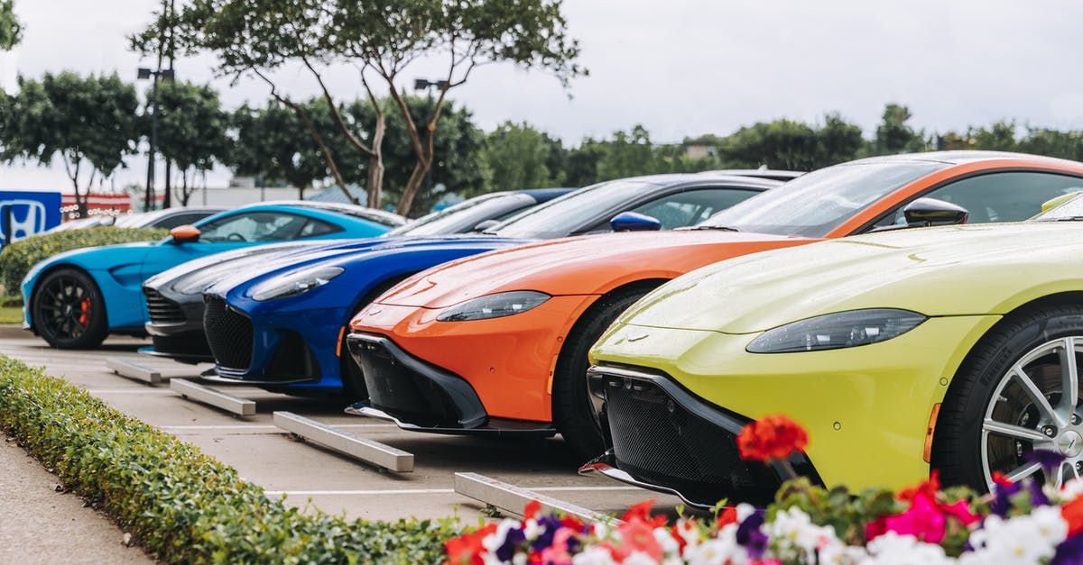 Why is there a line of parked cars at the left of the general lane in Otay Mesa Port of Entry? - Row of contemporary multicolored sports cars with strong engines parked on sunny street Why is there a line of parked cars at the left of the general lane in Otay Mesa Port of Entry? - Row of contemporary multicolored sports cars with strong engines parked on sunny street