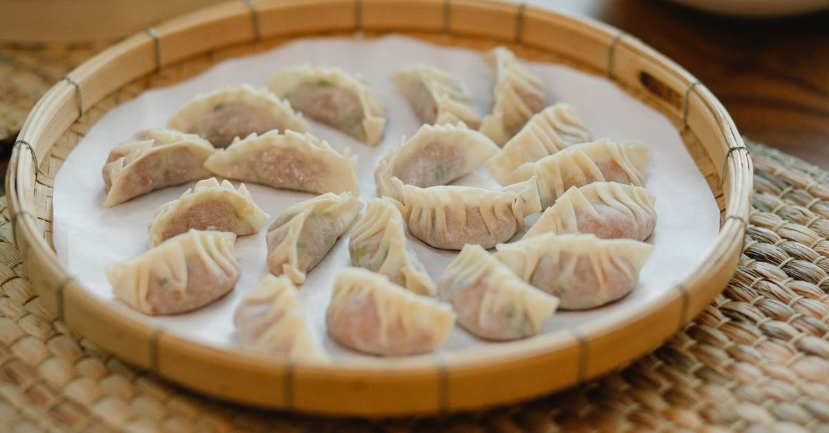 Why is there no tray table in the front row of airlines? - Fresh dim sum in bamboo tray on straw mat Why is there no tray table in the front row of airlines? - Fresh dim sum in bamboo tray on straw mat