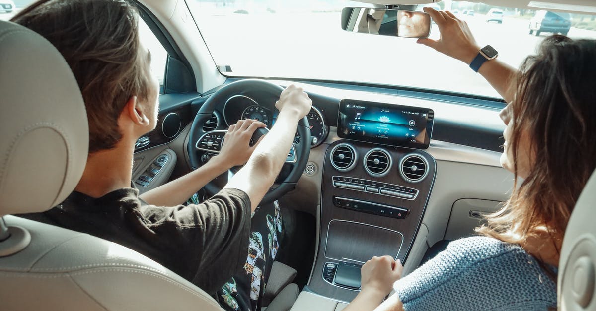 why might a drivers license # be required for a plane trip? - Woman in Black and White Stripe Shirt Driving Car why might a drivers license # be required for a plane trip? - Woman in Black and White Stripe Shirt Driving Car
