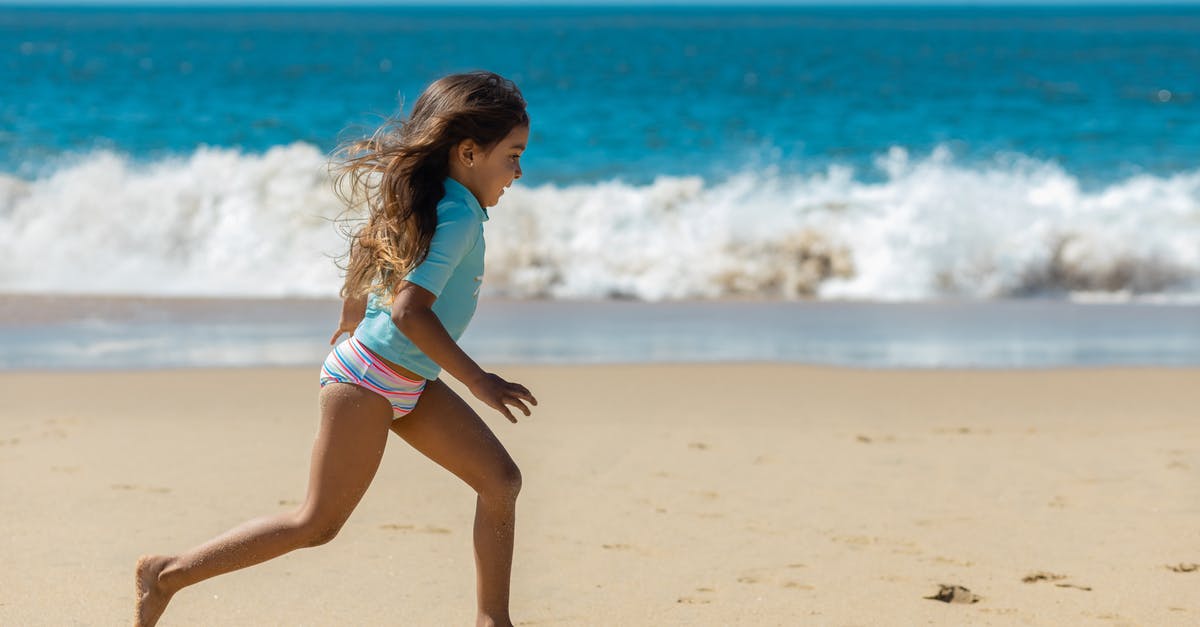 Why should you have travel insurance? - A Young Girl Running on the Beach Why should you have travel insurance? - A Young Girl Running on the Beach