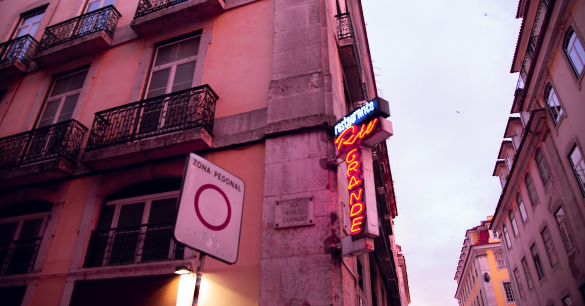 Why was I asked to provide proof of travel AFTER returning from Schengen area? - Old residential building with signboard in twilight Why was I asked to provide proof of travel AFTER returning from Schengen area? - Old residential building with signboard in twilight