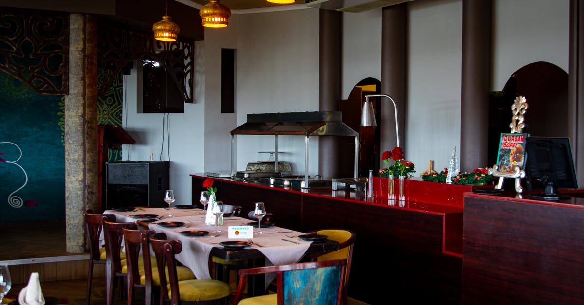Why was my reservation lowered? - Brown Wooden Table With Chairs in the Restaurant Why was my reservation lowered? - Brown Wooden Table With Chairs in the Restaurant